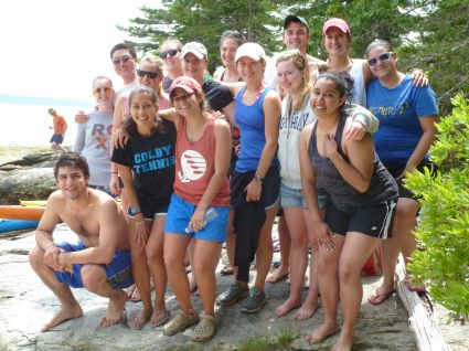2013 REU students outside on rocks by the water.